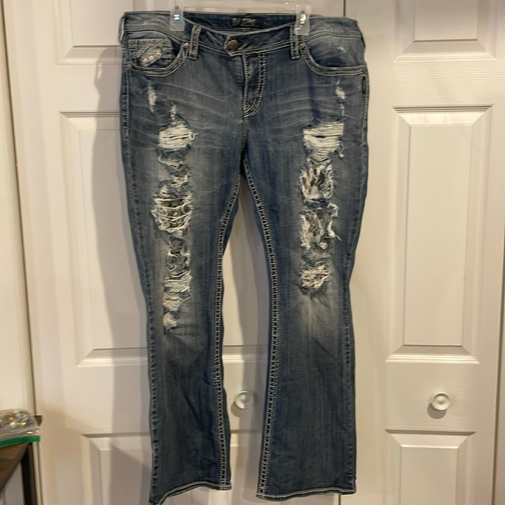Women’s silver jeans with lace distress